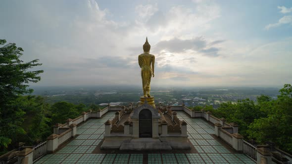 Time lapse of golden buddha pagoda stupa. Wat Phrathat Khao Noi Temple Park, Nan, Thailand