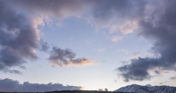 Timelapse of Epic Clouds at Mountain Medow at Autumn Time. Wild Endless Nature with Snow Storm Sky