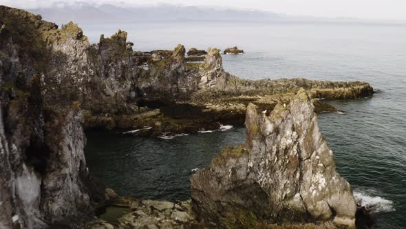 Drone Over Londrangar Rocky Basalt Cliffs At The Shoreline Of Snaefellsnes Peninsula In Iceland. Aer