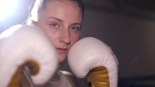 A Woman Boxer Trains Punches a Training Day in the Boxing Hall a Woman Quickly Beats a Series