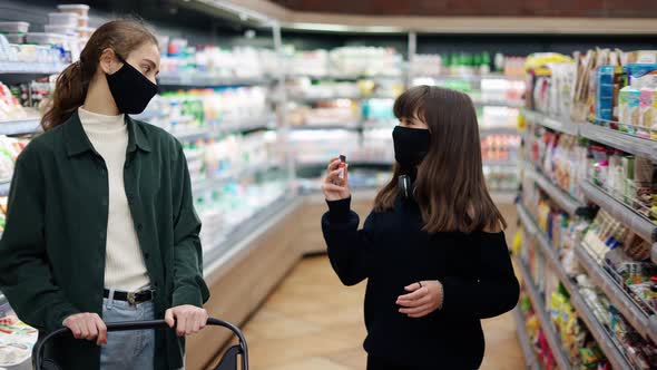 Moms Allows to Buy a Sweet to Her Teen Daughter in the Supermarket