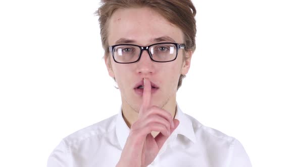 Man in Glasses Gesturing Silence Finger on Lips