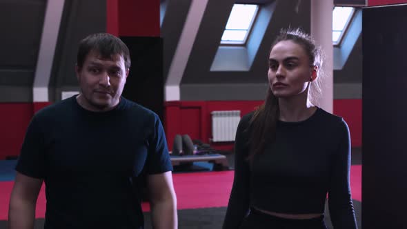 Woman and Man Having a Boxing Training in the Gym