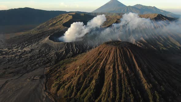 Stunning Aerial View of Beautiful Mountain Volcano Surrounded By Clouds of Smoke