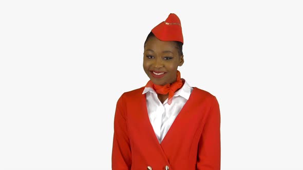 African American Stewardess Winks a Slight Flirt Sends an Air Kiss. Alpha Channel