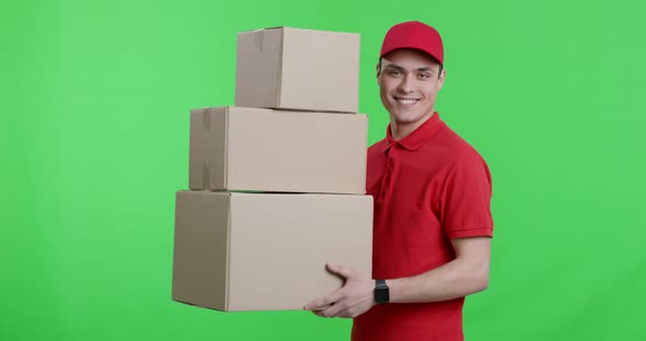 Courier in Red Uniform Walking with Parcels