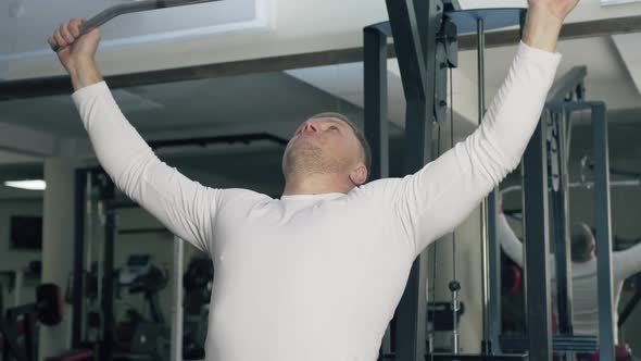 Bodybuilder Trains in the Gym