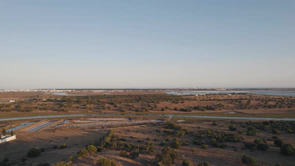 Low level aerial dolly out shot overlooking the landscape from Forte de São Sebastião Castro Marim.