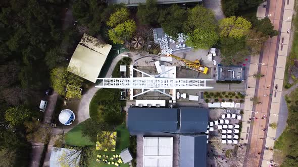 Workers building Ferris wheel in Palanga, aerial top down view