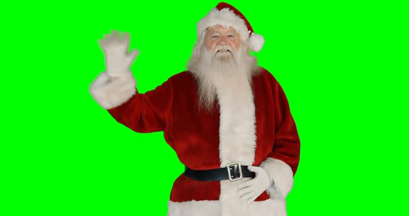 Portrait of happy santa claus waving hand