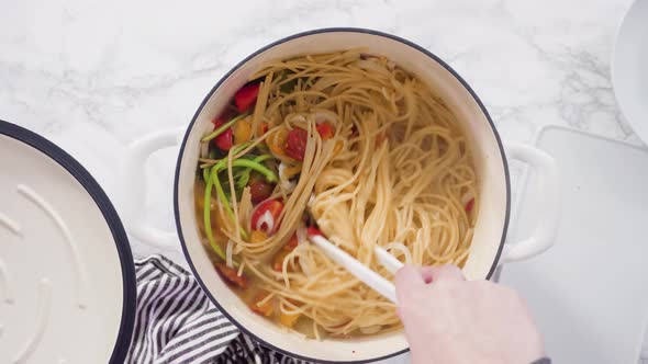 Flat lay. Step by step. Cooking on pot pasta recipe in an enameled cast iron dutch oven.