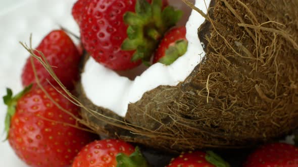 Rotating coconut strawberry. Tropical Fruit Summer Juicy Berries Tropics Bali Vegetarian