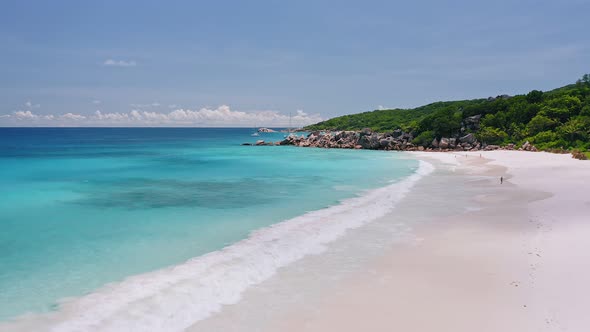 Aerial Low Fly Above Tropical Sandy Beach Grand Anse