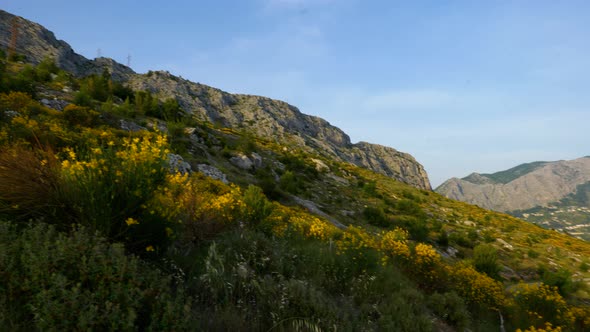 4K Cinematic nature travelling footage of a panoramic view of the cliffs and mountains of Omis next