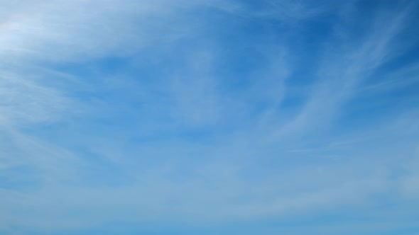 4K Time lapse of beautiful blue sky with clouds background.