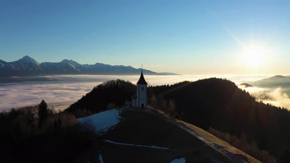 Church of St. Primoz and Felicijan at Sunrise. Julian Alps. Jamnik, Slovenia