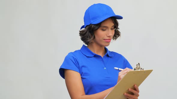Happy Delivery Girl with Clipboard and Pen Writing
