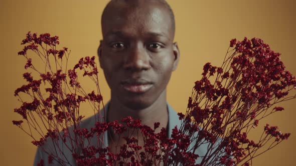 Man With Dark Red Flowers