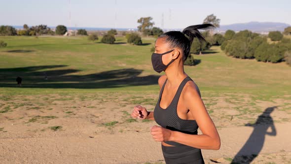 Mixed ethnicity woman working out in the park