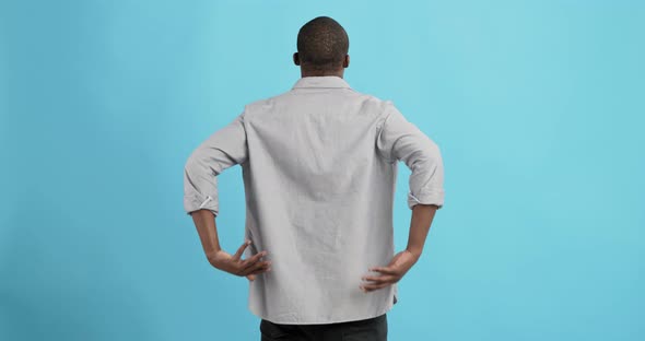 Black Man Holding His Hands Behind His Back, Stretching Spine