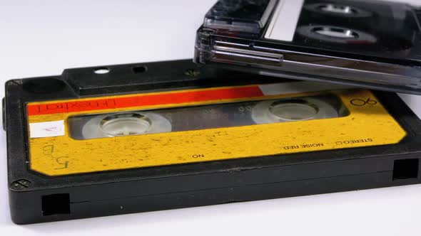 Two Vintage Audio Cassette Rotates on White Background