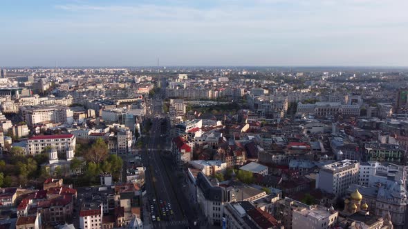 Aerial Pullback Bucharest City, Sunny Day during Golden Hour.