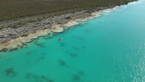 People Riding Kayak in Los Rapidos Lagoon in Bacalar Mexico