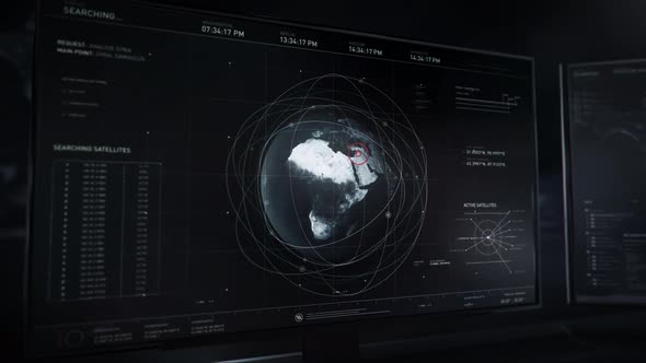Computer running a target location software. Analyzing military satellite data alt