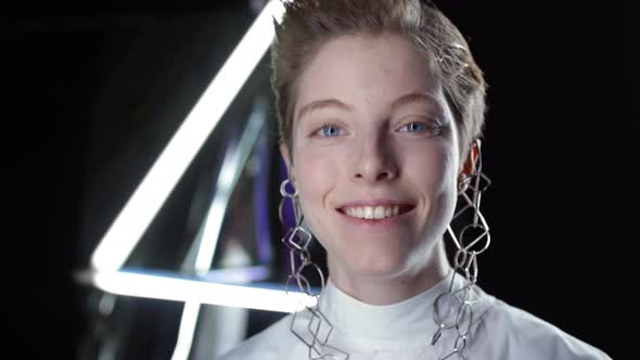 Young Woman Wearing Futuristic Earrings