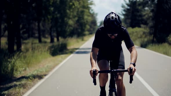 Sport Recreation Cycling Exercise. Cyclist Fitness Triathlon On Road Bike. Hard Workout. Triathlon.