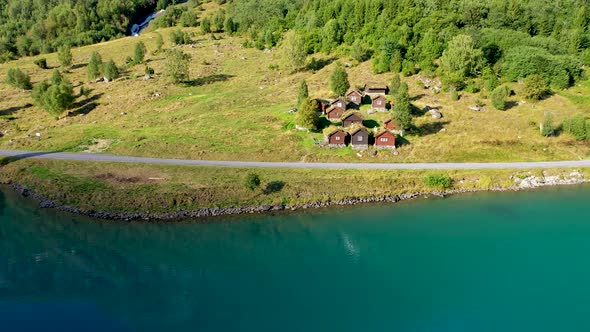 Cattle Shed with Grass top roof near a beautiful lake, Aerial view