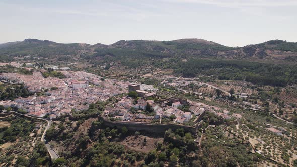 Castelo de Vide fortress and surrounding landscape, Portugal. Aerial descendent