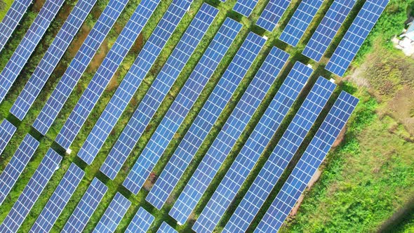 Drone fly over solar farm, renewable energy from solar.