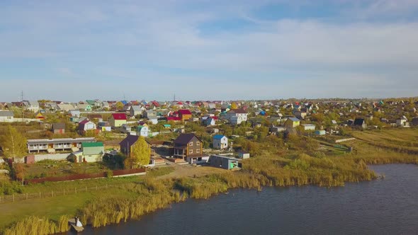 Cottage Town and Just Married Couple at Calm River Panorama