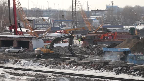 Working in Construction Site Excavator Digging Into the Ground