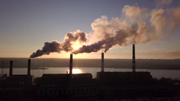 Smoke From Factory Chimneys on Background of Sunset Sky 001