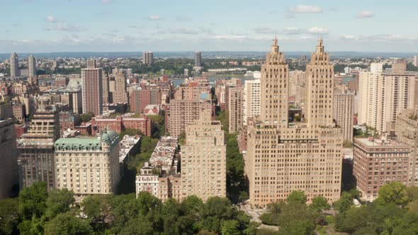 Beige Brown Residential Buildings in New York City on Manhattan Island Aerial Slide Right