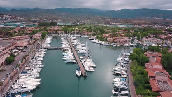 Aerial View on White Sailing Yachts and Boats at Marina Portorosa, Furnari, Italy. Mountains and