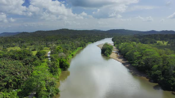 Aerial Drone View of Rainforest River and Mountains Scenery in Costa Rica at Boca Tapada, San Carlos