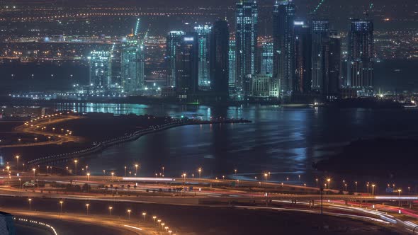 Construction of New Skyscrapers in Dubai Creek Harbor Aerial Night Timelapse