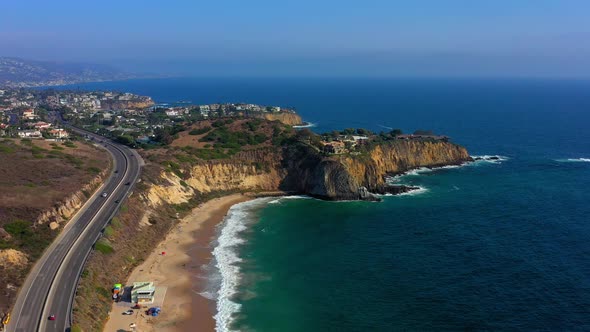 Laguna Beach CA flying near the Pacific Coast Highway looking at houses on a cliff. A nice view of t