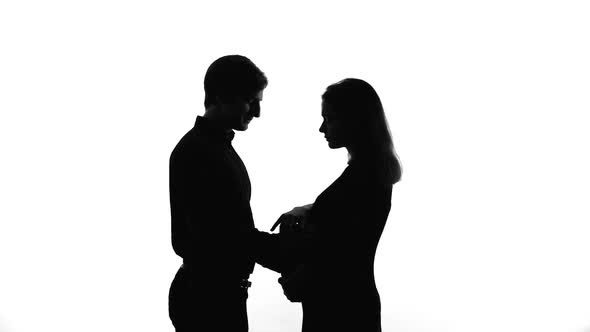 Man Stroking Pregnant Woman Belly, Offers Support, Lady Declines His Help