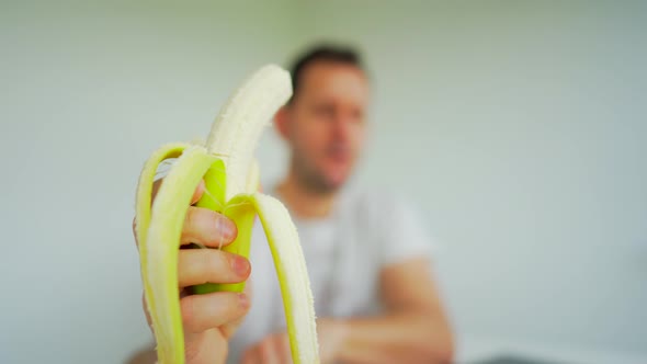 Men eat a Banana