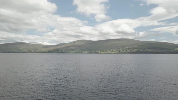 Scenic View Of Mountains And Sea In Blessington Lake In Wicklow Ireland - aerial shot