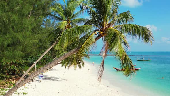 Wide angle flying abstract shot of a summer white paradise sand beach and aqua blue water background