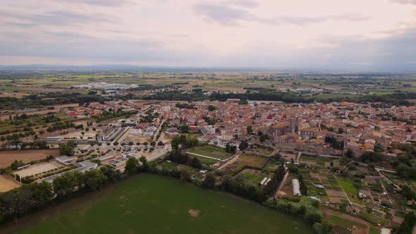 Drone Flight Over Field Towards Castello D'Empuries Town