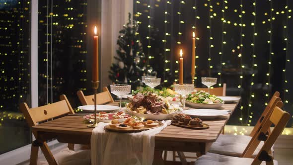 Festive Dinner at Home Burning Candles on Dining Table