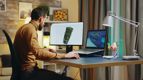 Bearded Engineer Sitting at His Desk in Home Office