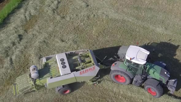 aerial tractor baler close up working slow motion