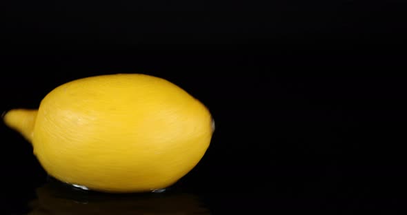 One Fresh Lemon Spinning on the Table. 